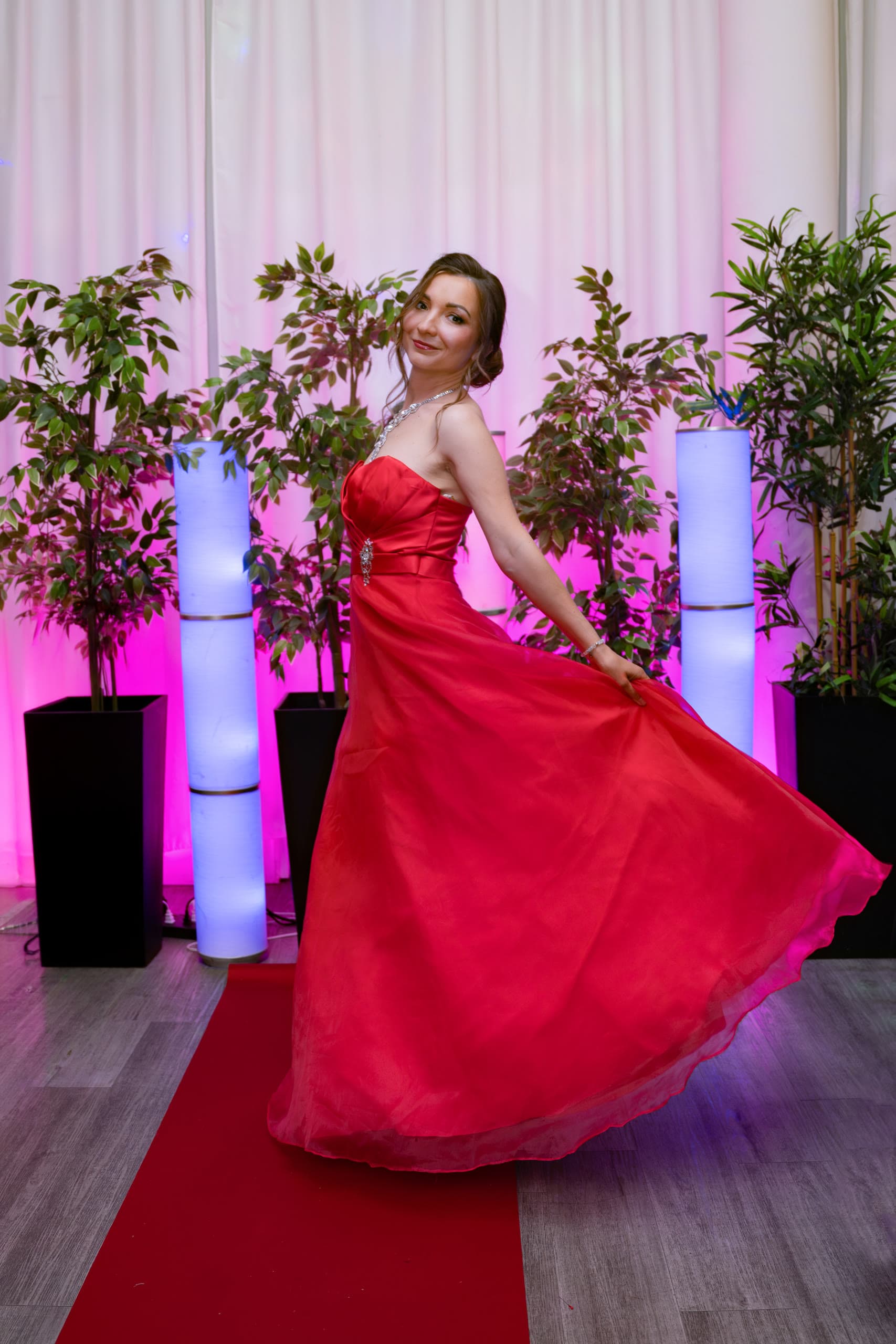 Red gown swirling as Anastasiia dances