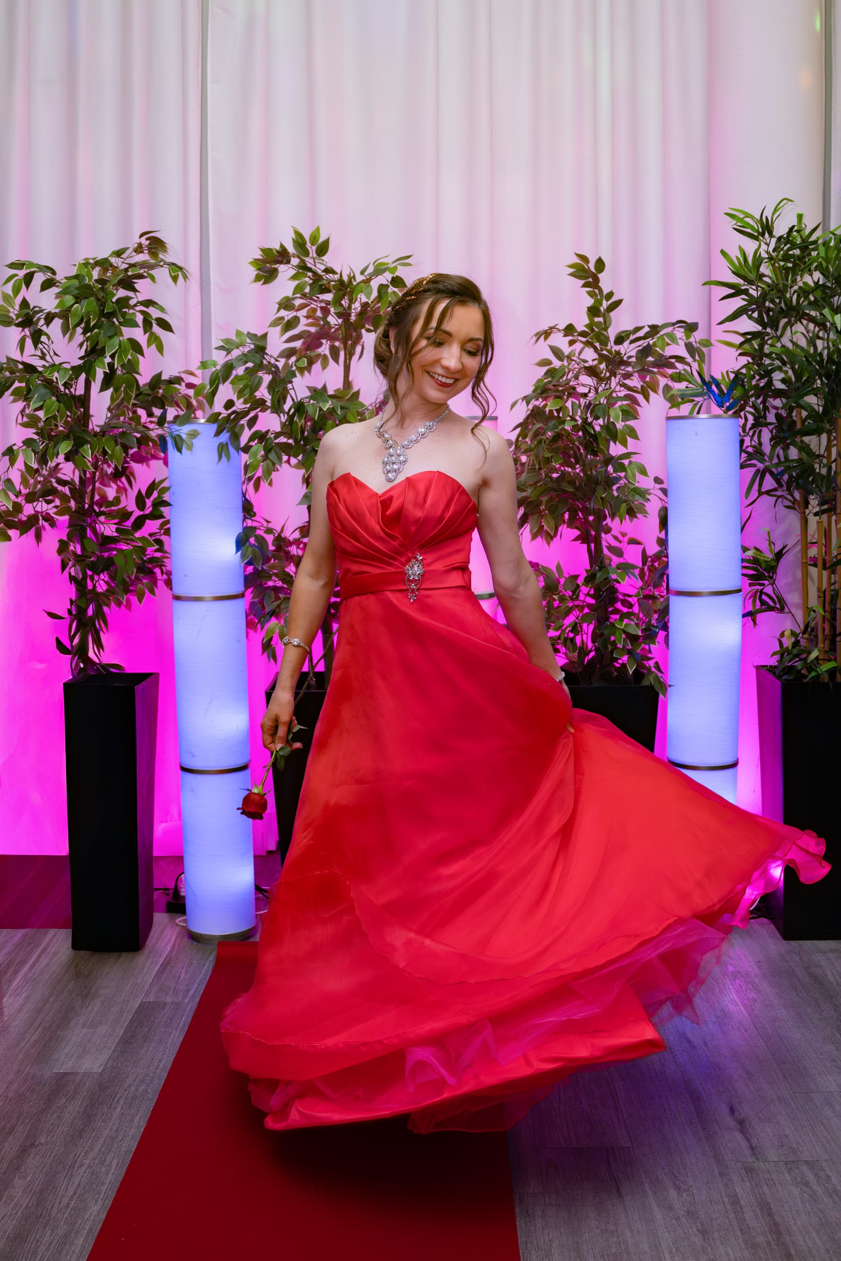 Anastasiia with her red gown in motion