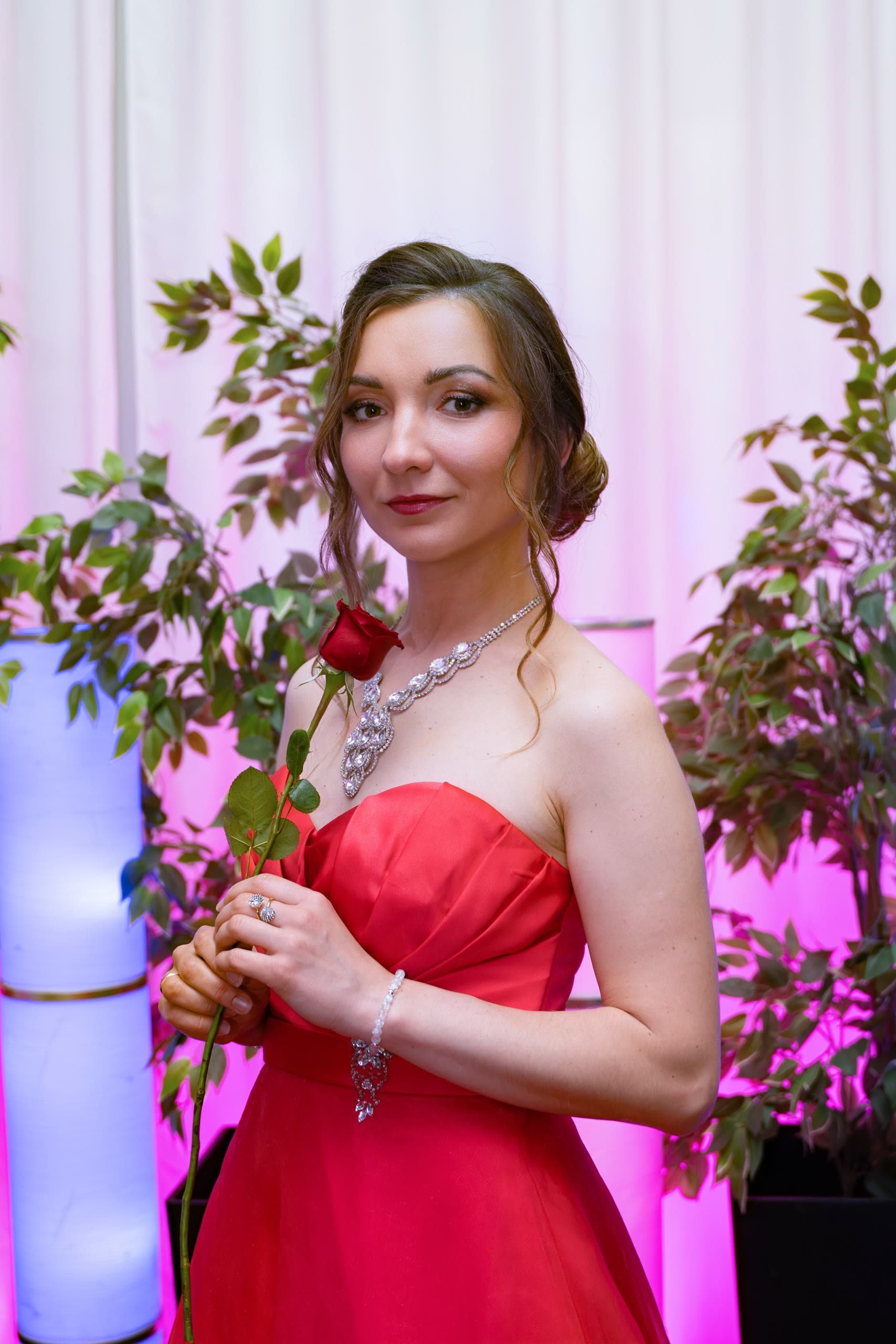 Anastasiia holding a red rose